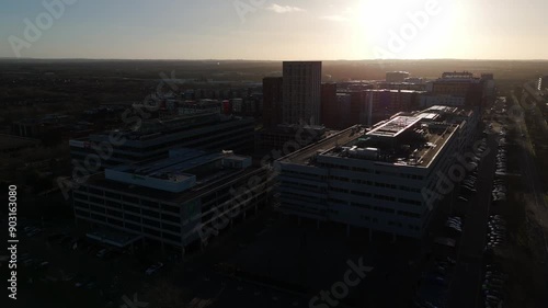 Overhead dolly shot of Milton Keynes Business District, facing west with sun setting