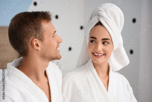 Young couple in bathrobes after shower at home, closeup