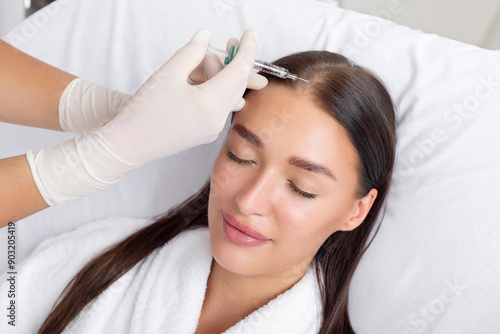 Photos Lady receiving hair mesotherapy injections from professional trichologist