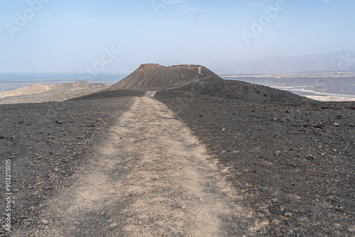 The inhospitable countryside between Garrayto and Lake Assal is strewn with lava and pale, friable material, Garrayto, Djibouti photo