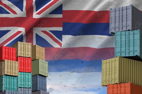 Hawaii US state flag and big stack of shipping cargo containers in docks with sky background close up photo