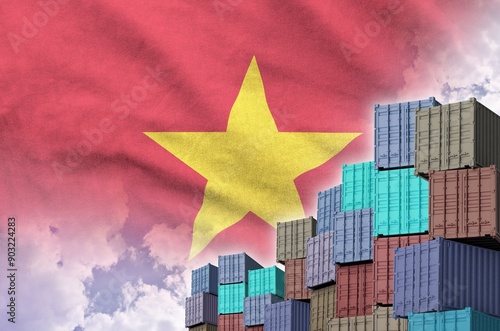 Vietnam flag and big stack of shipping cargo containers in docks with sky background close up photo