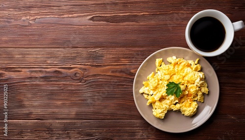 Scrambled eggs and cup of hot coffee on brown wooden table background with copy space, top view, generative AI