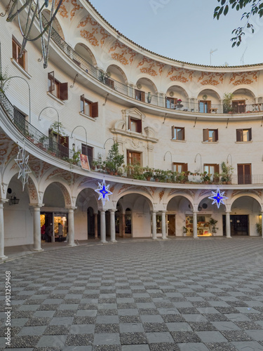 Plaza del Cabildo, curved building with decorated arches and star decorations, in Seville Capital photo