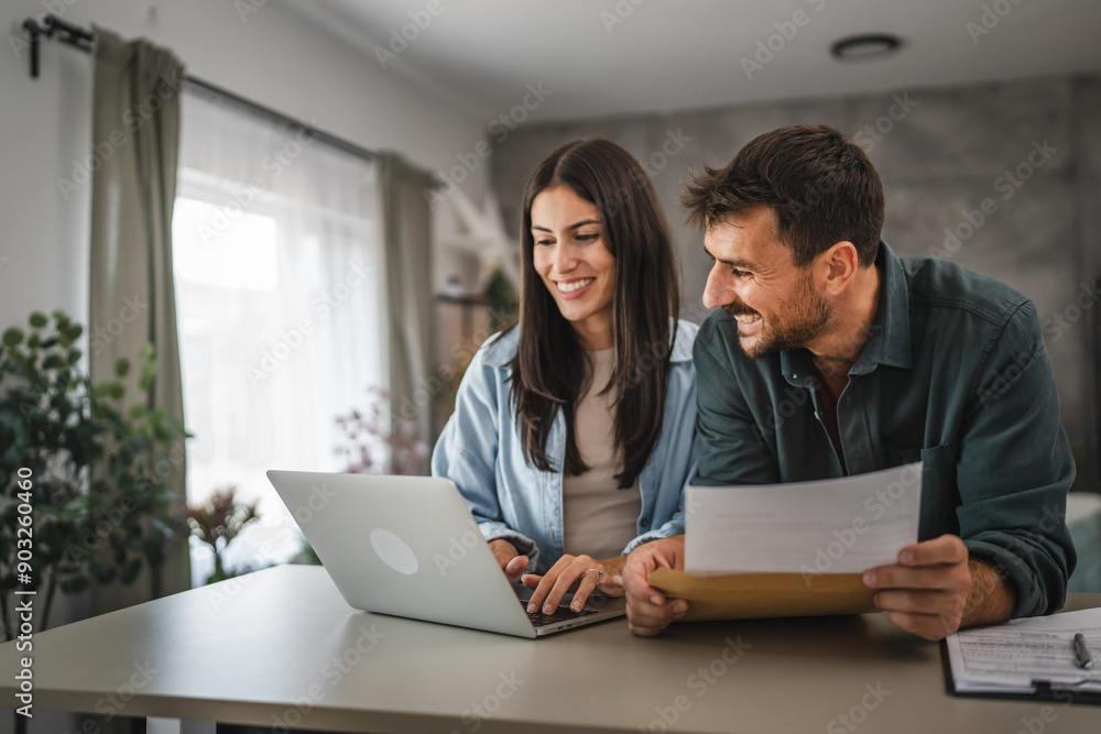 © Miljan Živković - couple boyfriend and girlfriend read together letter from envelope