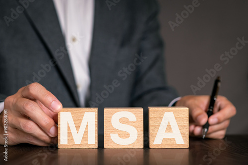There is wood cube with the word MSA. It is an abbreviation for Master Service Agreement as eye-catching image.
