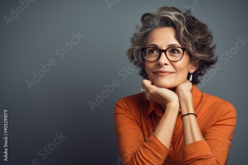 Wisdom and Serenity: Capturing the Essence of a Happy, Intelligent Woman in a Reflective Moment
