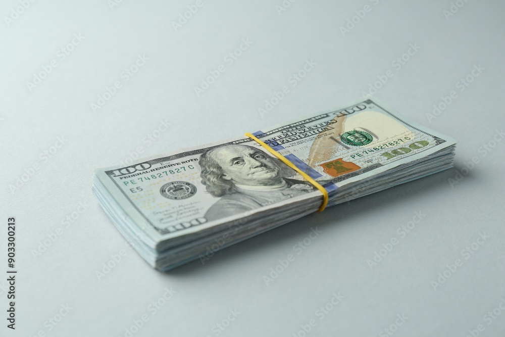 Dollar banknotes on grey background. American currency Dollar banknotes on grey background. American currency