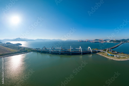 Guseong-ri, Haenam-gun, Jeollanam-do, South Korea - September 29, 2022: Aerial view of drain gate of Yeongam Embankment between Yeongam Lake and sea
 photo