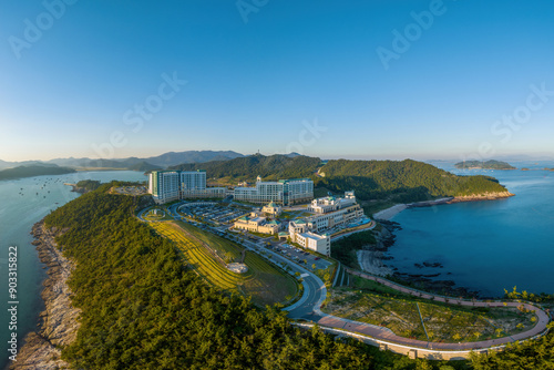 Chosa-ri, Jindo-gun, Jeollanam-do, South Korea - September 29, 2022: Aerial and summer view of building of Jindo Sol Beach on the hill near the sea
 photo