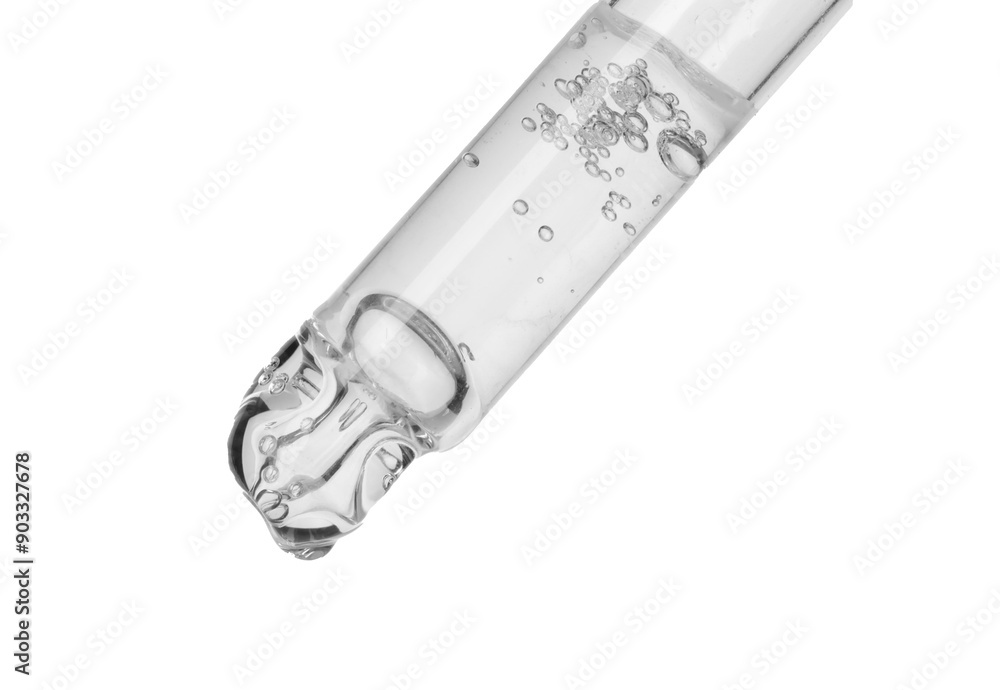 Dripping cosmetic serum from pipette on white background Dripping cosmetic serum from pipette on white background
