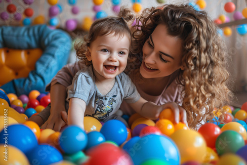 Mother and boy enjoying Montessori-based playtime to improve sensory and motor skills with a variety of colorful toys and balls
