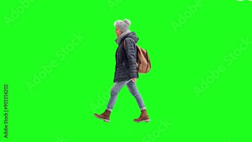 Grandma backpacks and travels, green screen background photo