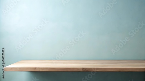 Wooden shelf against a blue wall.