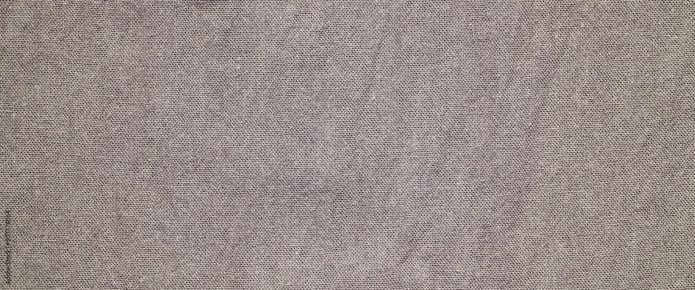 Fototapeta premium Brown cotton fabric texture background, Canvas surface textile, wallpaper, banner