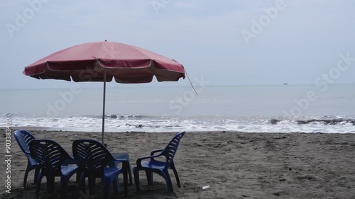 Beach view with chairs and parasols for shade