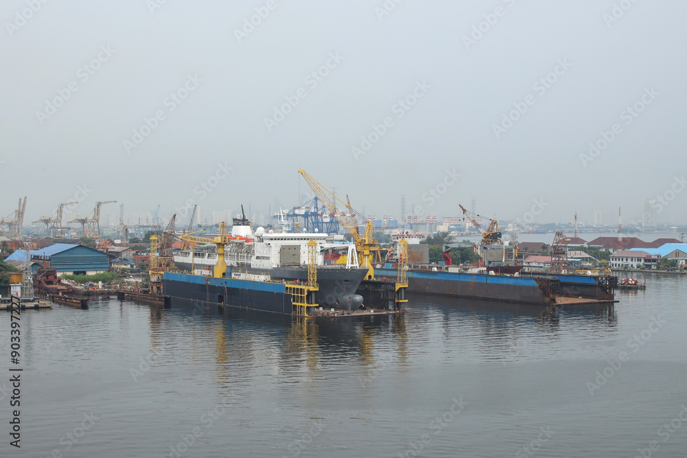 Container Ship Docked In The Port For Loading And Unloading Containers Container Ship Docked In The Port For Loading And Unloading Containers