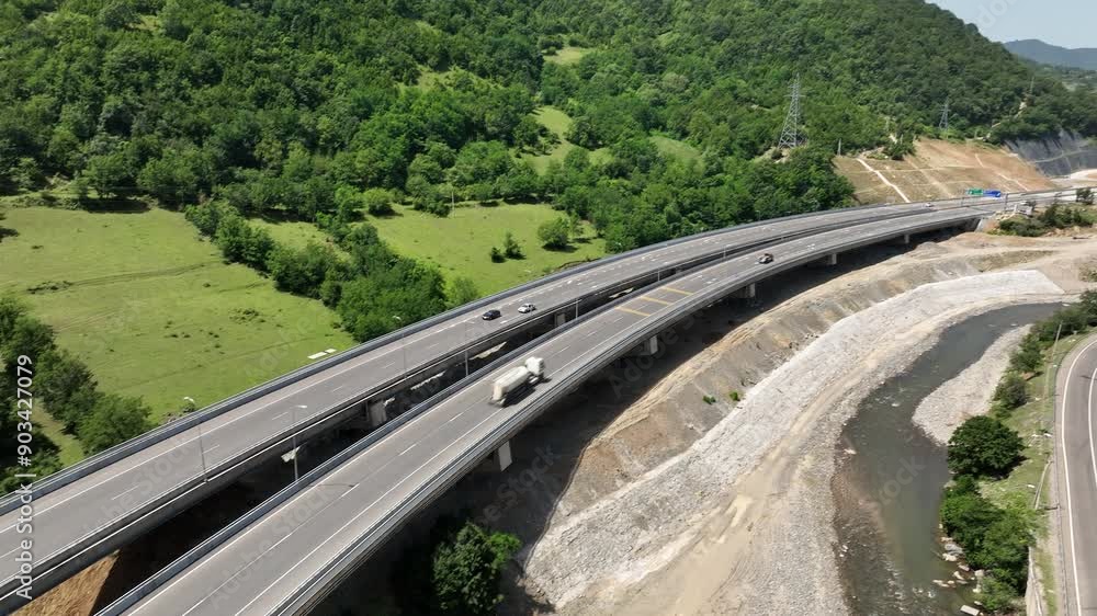 Aerial view of new road through Rikoti pass. Drone shot above highway in mountains of Georgia 2024 summer Aerial view of new road through Rikoti pass. Drone shot above highway in mountains of Georgia 2024 summer