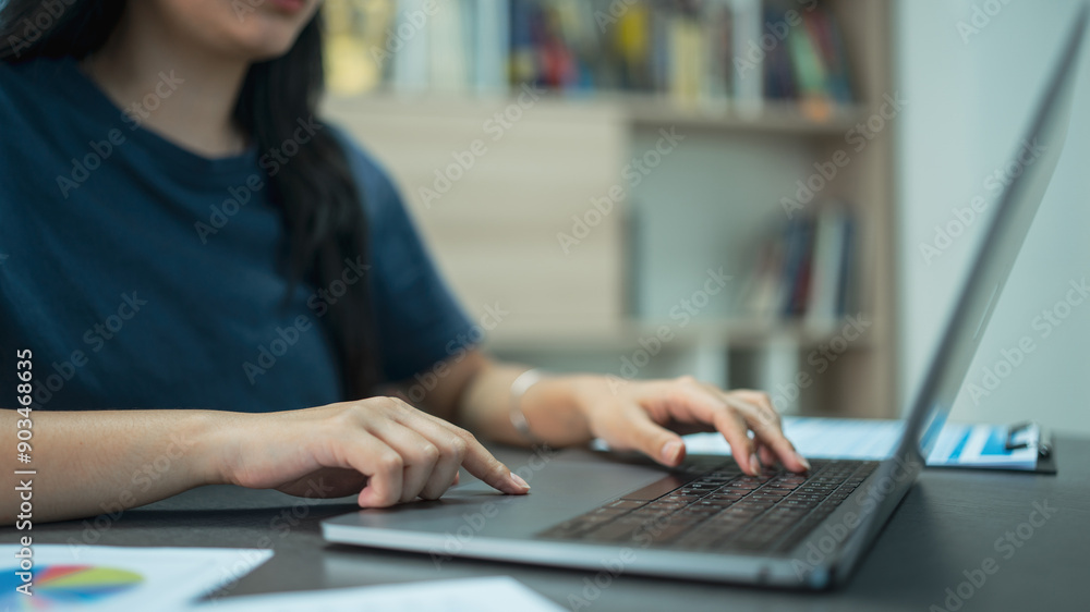 Fototapeta premium Business financing accounting banking concept. Businesswoman hand doing finances and calculate on desk about cost at home office.