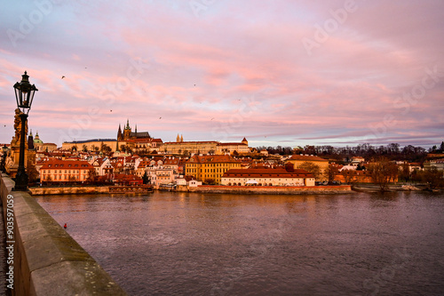 Prague at sunrise over the famous Charles Bridge Karluv most with panoramic view of the historic Prague Castle Prazsky hrad early morning with beautiful sky, Prague, Czech Republic photo