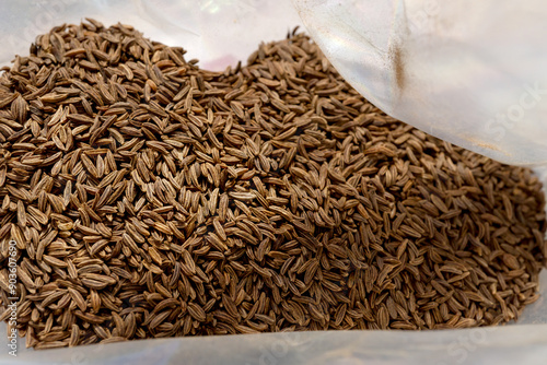 Close-up of cumin seeds in a bag photo