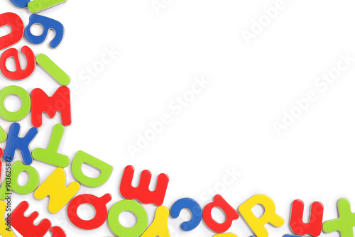 Alphabet. Many colorful magnetic letters isolated on white, top view