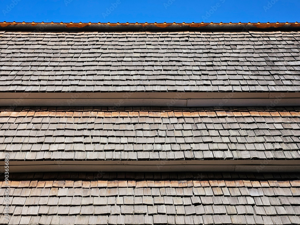 Layer of Northern Thai wooden roof with blue sky pattern and texture background