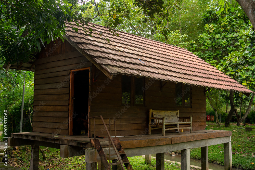Traditional Wooden Stilt House by the River in Indonesia Traditional Wooden Stilt House by the River in Indonesia