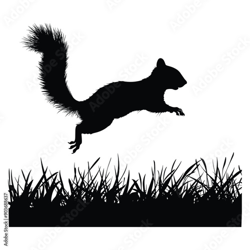 Silhouette of a squirrel jumping over grass. 