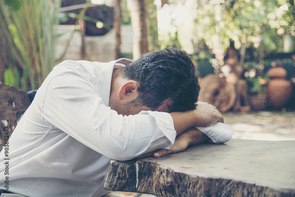Failure businessman stress bankruptcy man sitting wood desk feeling nagative depression have headache. Men unemployed jobless recession crisis stress lost job. Despair Failure businesspeople concept Failure businessman stress bankruptcy man sitting wood desk feeling nagative depression have headache. Men unemployed jobless recession crisis stress lost job. Despair Failure businesspeople concept