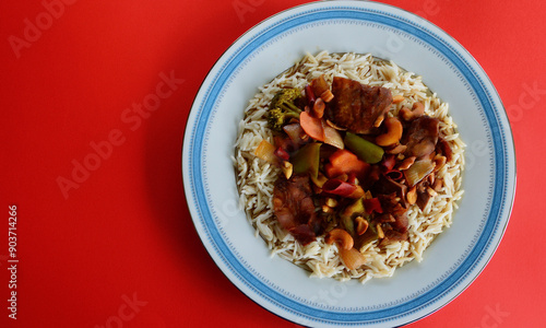 Delicious Malaysian style duck with vegetables and steamed rice.