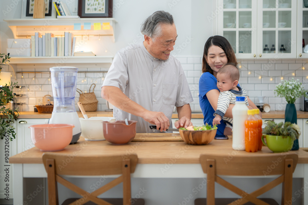Mother and tiny child in the kitchen preparing dinner with grandfather Mother and tiny child in the kitchen preparing dinner with grandfather