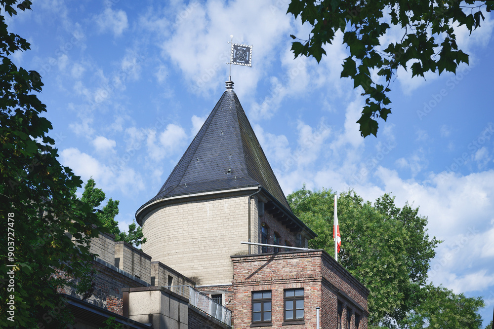 part of the preserved medieval city wall of cologne at the Sachsenring with a view of one of the defense towers from the inside of the city part of the preserved medieval city wall of cologne at the Sachsenring with a view of one of the defense towers from the inside of the city