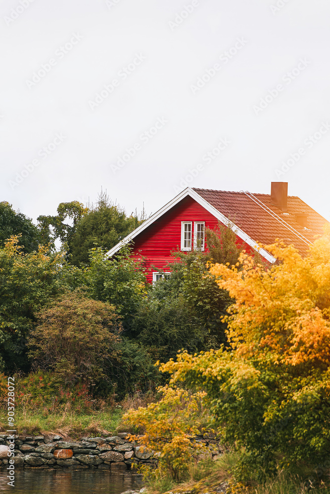 Quaint red house in a picturesque Norwegian landscape Quaint red house in a picturesque Norwegian landscape