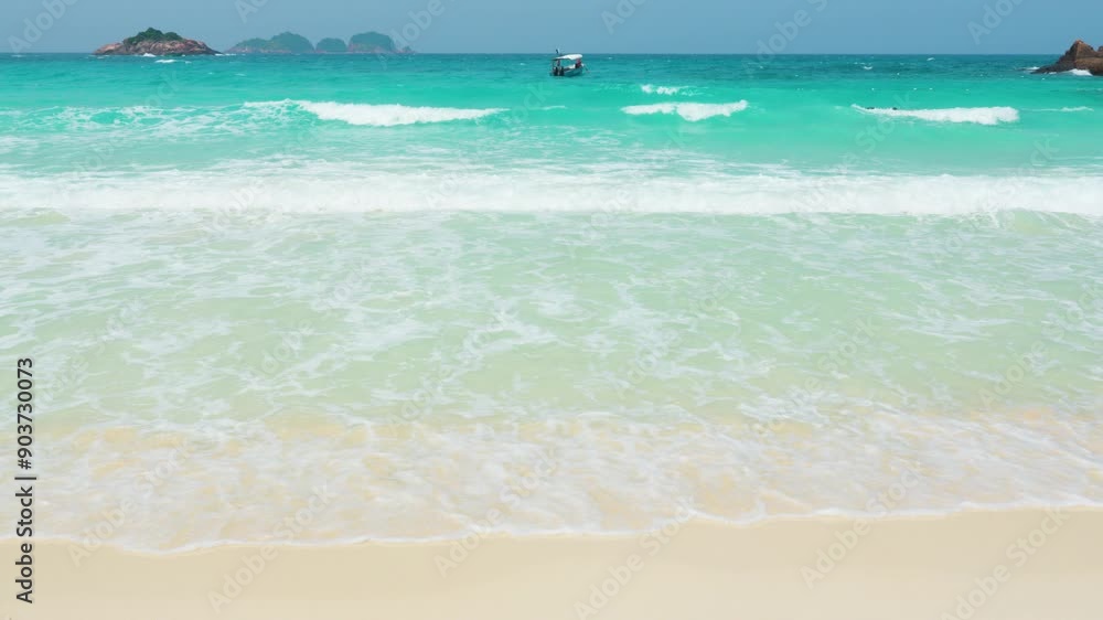 Soothing waves on sandy beach in redang island, malaysia Soothing waves on sandy beach in redang island, malaysia