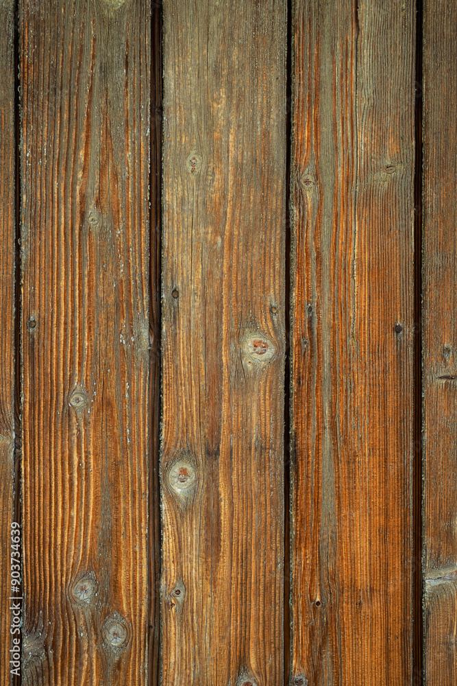 Fototapeta premium Rustic wooden planks texture with visible grain patterns and knots.