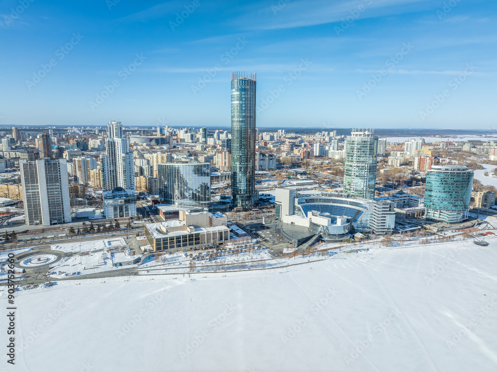 Naklejka premium Yekaterinburg city with Buildings of Regional Government and Parliament, Dramatic Theatre, Iset Tower, Yeltsin Center, panoramic view at winter sunset.