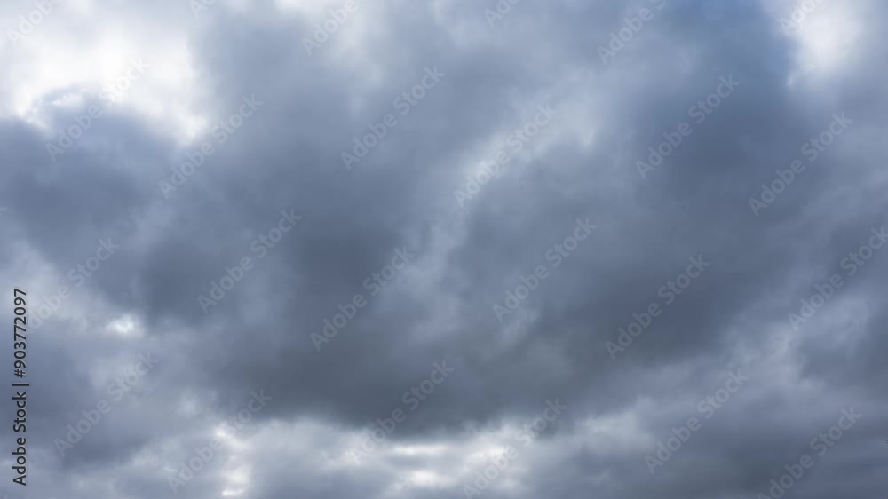 Dramatic gray rain clouds sweep across the sky Dramatic gray rain clouds sweep across the sky