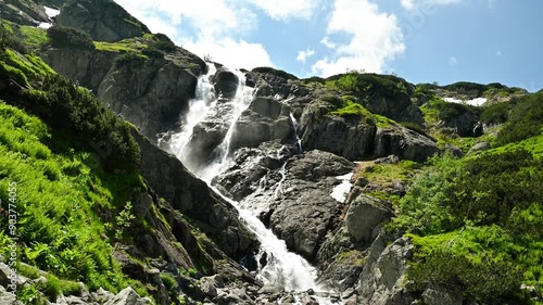 Waterfall in the mountains in summer. Siklawa Falls.