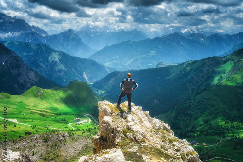 Man on the rock in alpine m...