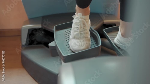 Details Of Woman Shoes On The Stairclimber Machine  photo