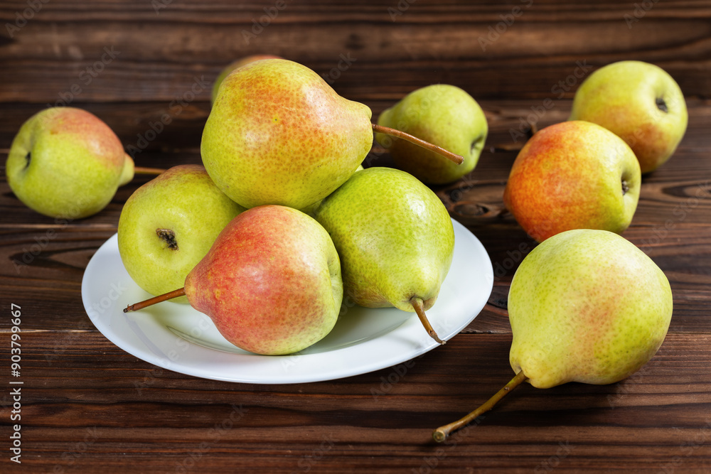 Fresh pear fruit on plate with wooden table, Healthy fruit Fresh pear fruit on plate with wooden table, Healthy fruit