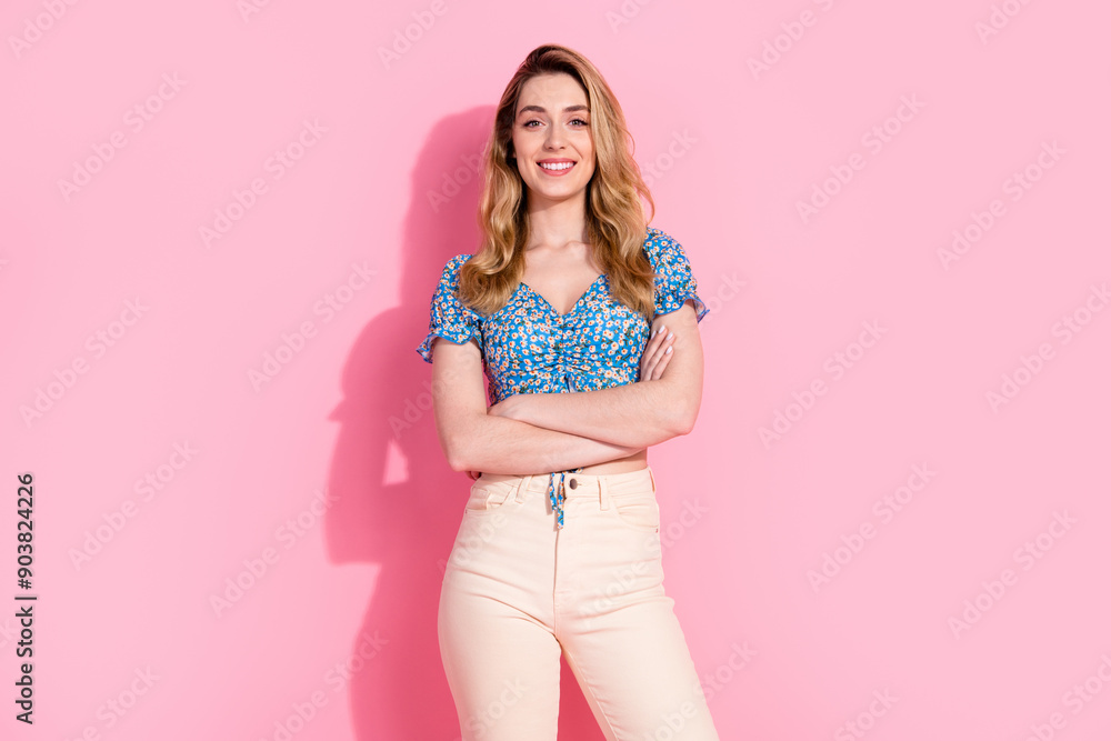 Photo portrait of pretty young girl confident pose crossed hands wear trendy blue flower print outfit isolated on pink color background Photo portrait of pretty young girl confident pose crossed hands wear trendy blue flower print outfit isolated on pink color background
