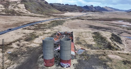 Remote Iceland farm, with a collapsed roof and scattered debris, serves as a poignant example of nature's ability to reclaim and transform abandoned areas. photo