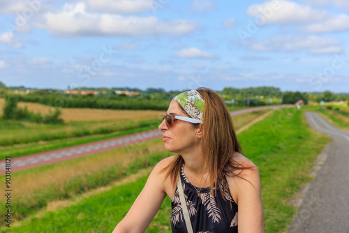 Frau mit E-Bike am Strand in Holland  photo