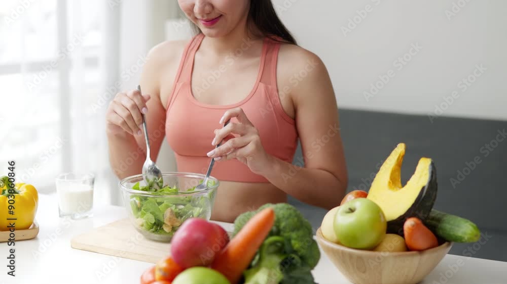 Healthy woman preparing cutting and mixing organic fruit and vegetable salad in kitchen for healthy lifestyle Healthy woman preparing cutting and mixing organic fruit and vegetable salad in kitchen for healthy lifestyle