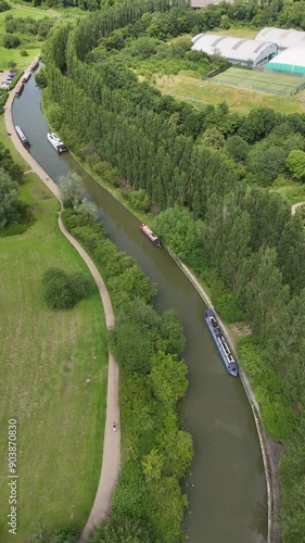 Aerial overhead dolly shot of Campbell Park Canal, Milton Keynes. Downhead Park appearing the background
