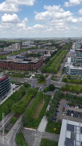 Aerial shot of roundabout intersection in Milton Keynes Central, Midsummer Boulevard, Milton Keynes Business District and the Hub in the background