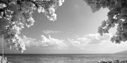 A black and white photograph of the ocean with waves crashing against the shore