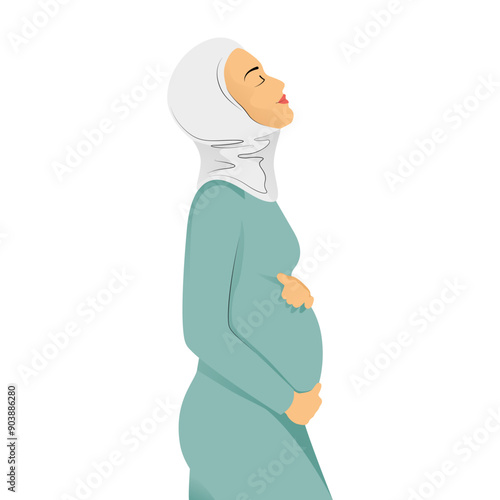 Pregnant muslim woman side view in a blue hijab tenderly holds her belly with a happy smile